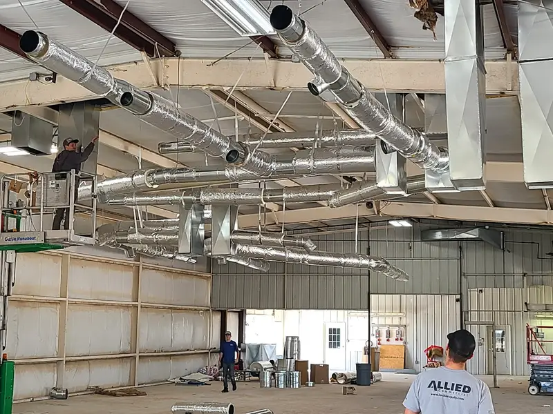 Ductwork installation inside a warehouse
